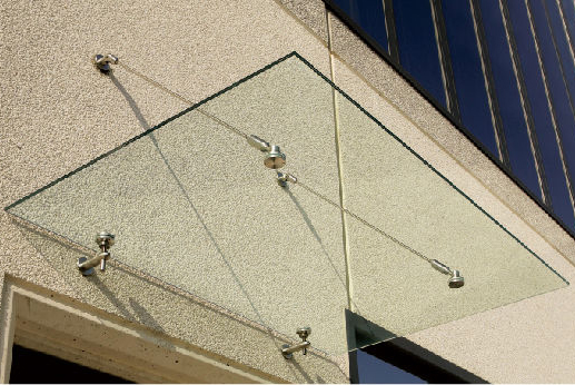 flat sheet of glass used as a canopy over a doorway