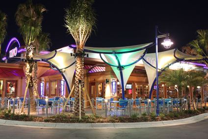fabric shade structures for outside dining, with colored decorative lighting